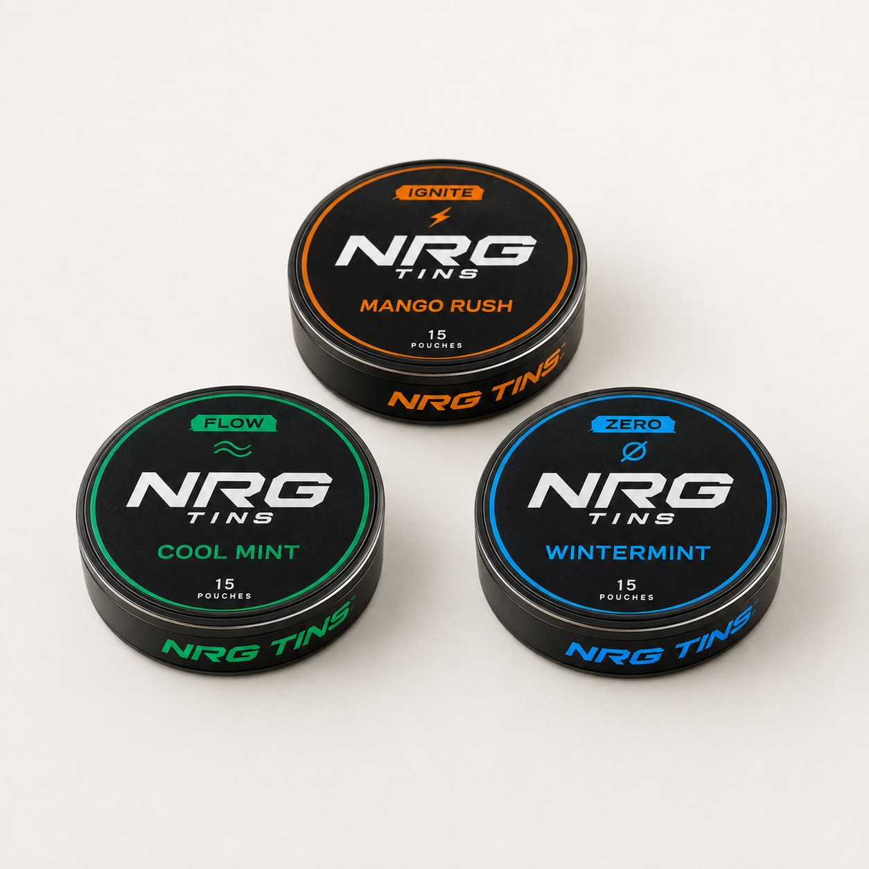 NRG Tins The Discovery Trio, 3 tins on a bone studio background.