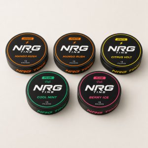 NRG Tins The Mango Rush Mix, 5 tins on a bone studio background.