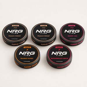 NRG Tins The Peach Frost Mix, 5 tins on a bone studio background.